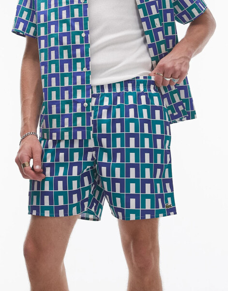 Lacoste print swim shorts in green