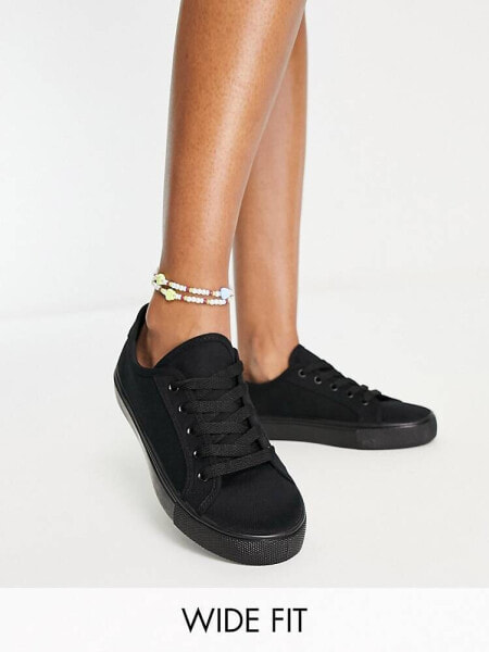 ASOS DESIGN Wide Fit Dizzy lace up trainers in black drench