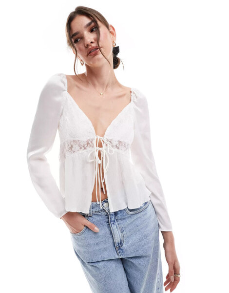 Vero Moda long sleeved tie front top with lace inserts in white