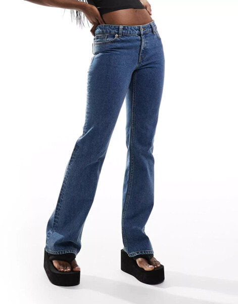 Monki Wakumi low waisted boot cut jeans in la lune mid blue