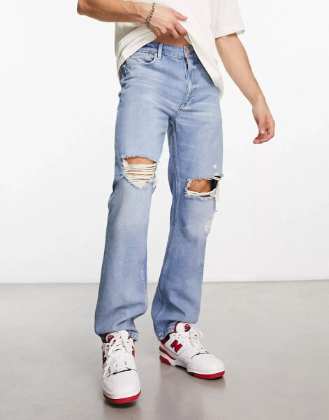 ASOS DESIGN straight leg jeans with rips in vintage light wash