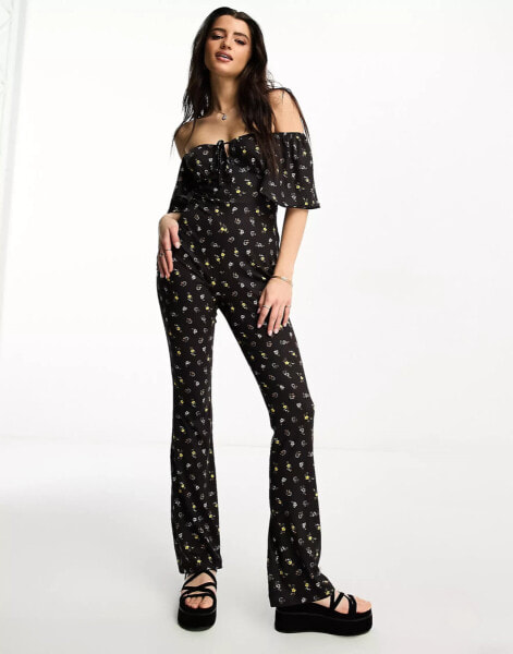 ASOS DESIGN jersey fluted sleeve jumpsuit with flare leg in ditsy floral