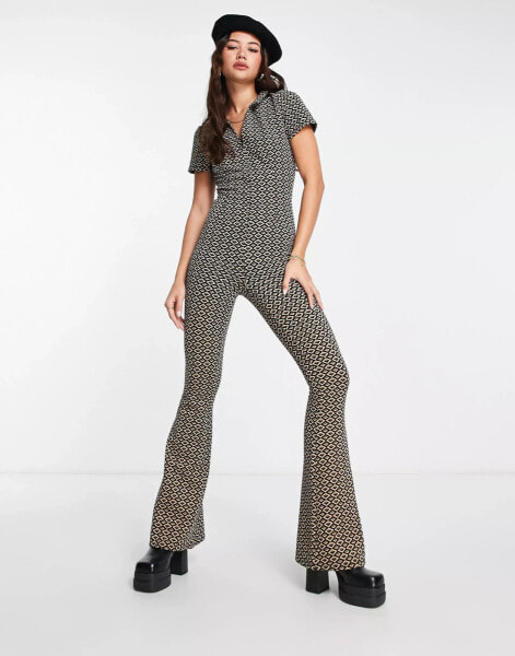 ASOS DESIGN zip front jumpsuit with flare leg in geo print