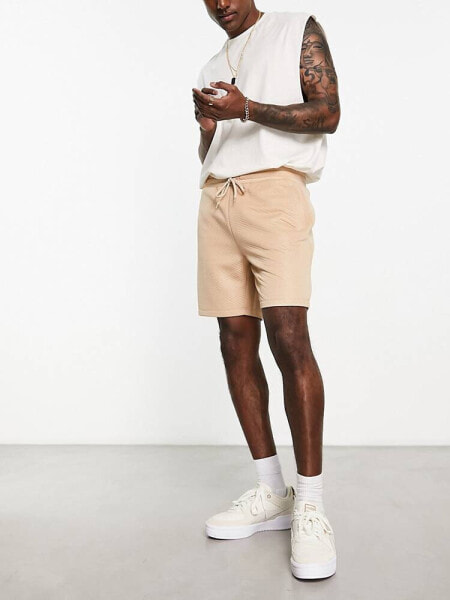 ASOS DESIGN slim shorts in beige quilted texture