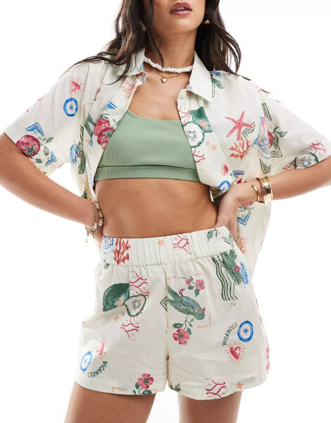 ASOS DESIGN linen look co-ord beach short in postcard print