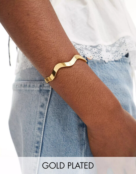 ASOS DESIGN waterproof stainless steel bangle bracelet with wiggle detail in gold tone