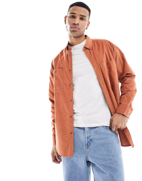 ASOS DESIGN 90s oversized cord shirt with double pockets in rust