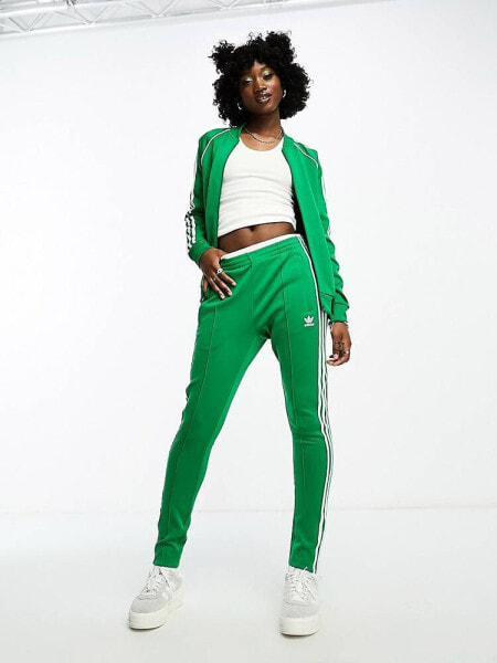 adidas Originals Adicolor superstar joggers in green 