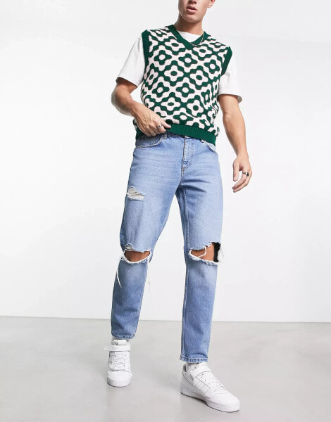 ASOS DESIGN tapered fit jeans with busted knees in mid wash blue - MBLUE