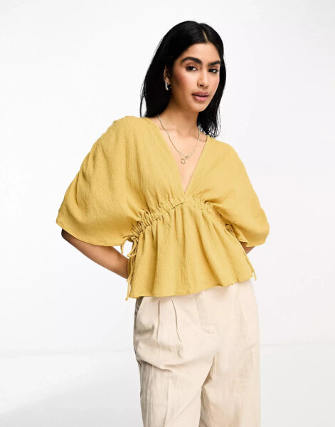 ASOS DESIGN plunge front crinkle top with tie side in ochre