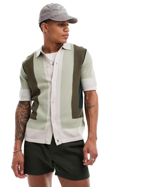 ASOS DESIGN knitted button through polo in green border pattern