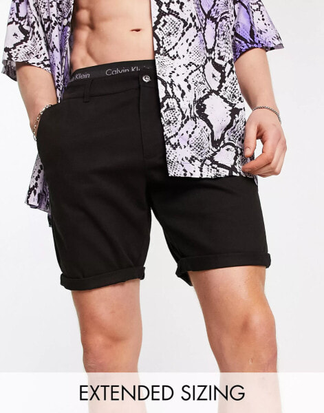 ASOS DESIGN skinny chino shorts in mid length in black