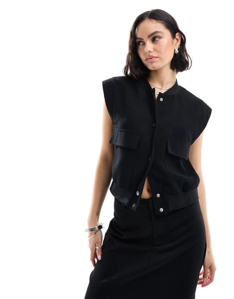 Pimkie tailored sleeveless pocket detail jacket in black