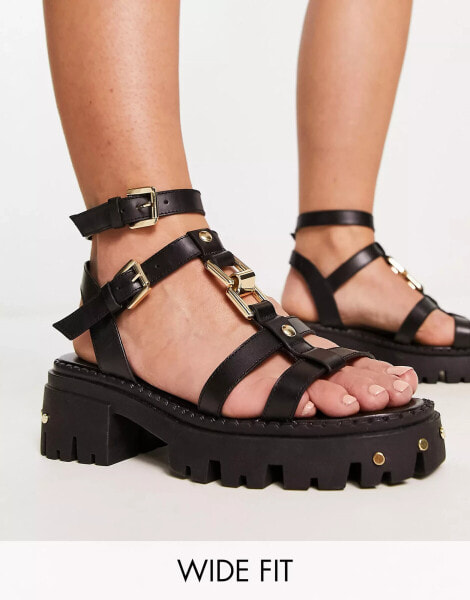 ASOS DESIGN Wide Fit – Forrest – Flache Sandalen aus Leder in Schwarz mit Riemen und dicker Sohle