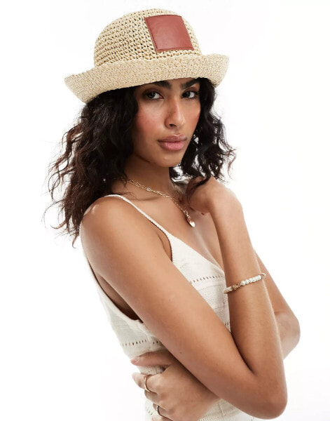 ASOS DESIGN straw crochet bucket hat with faux leather patch