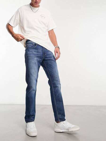 Levi's 502 tapered fit jeans in dark blue wash