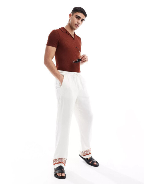 ASOS DESIGN relaxed linen trousers in white with embroided hem