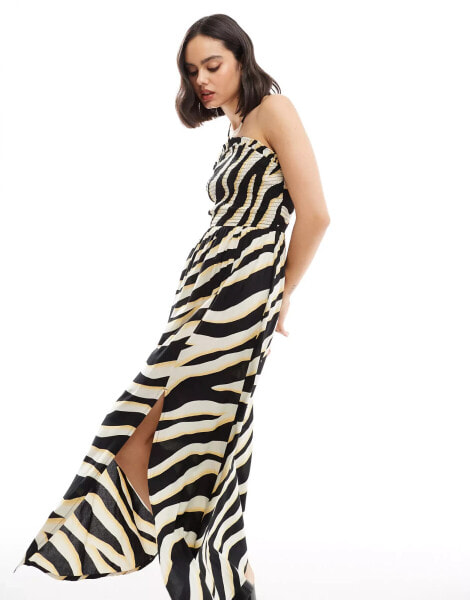 ASOS DESIGN shirred halter neck maxi dress in abstract print