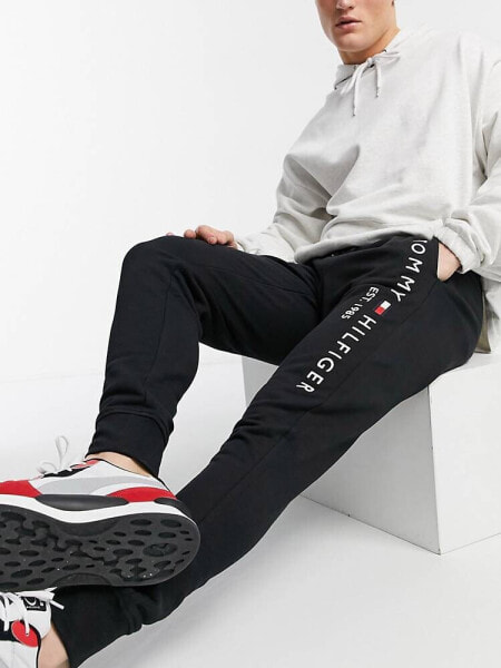 Tommy Hilfiger embroidered logo cuffed joggers in black