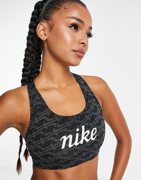 Nike Training Icon Clash Swoosh AOP graphic medium support sports bra in black