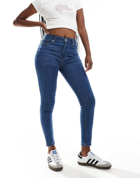 DTT Jo mid rise skinny jeans in mid blue wash