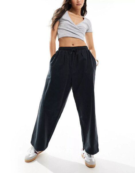 ASOS DESIGN oversized barrel leg pull on trouser in black