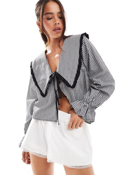 ASOS DESIGN oversized collar tie front blouse in black gingham