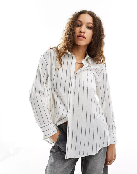 Reclaimed Vintage shirt multi-way asymmetric wrap shirt in black and white pinstripe