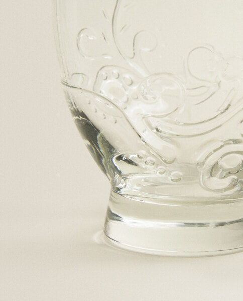 Raised floral design glass tumbler