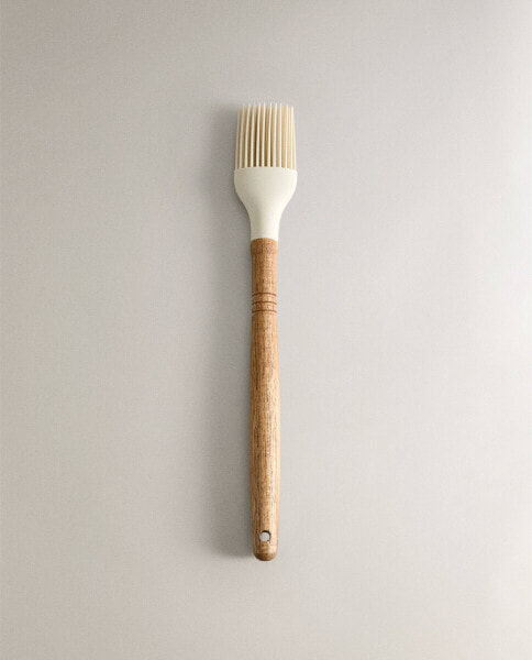 Silicone and wood brush