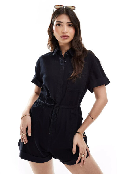 ASOS DESIGN soft denim playsuit with tie waist detain in black