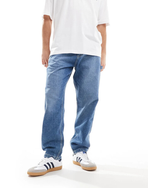 Lee Carpenter relaxed fit jeans in mid wash