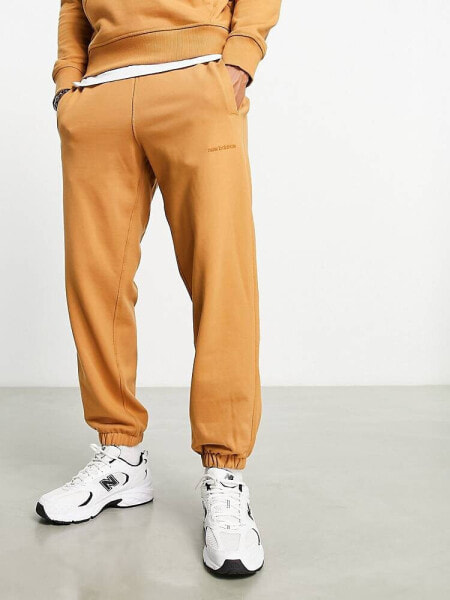 New Balance Athletics State Sweatpant in tan