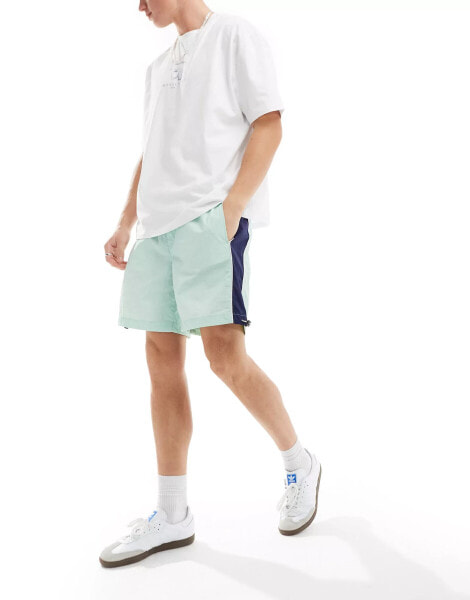 ASOS DESIGN nylon short in mint and navy side panels