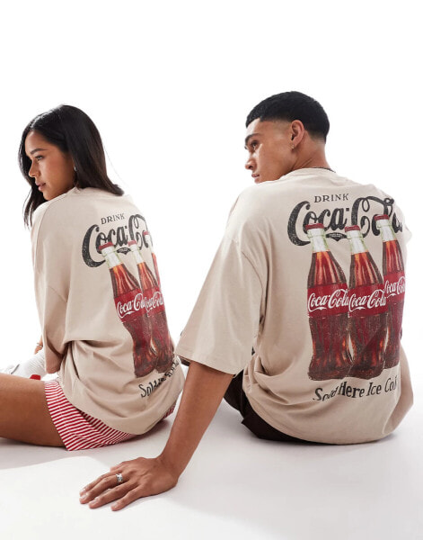 ASOS DESIGN unisex oversized license t-shirt with Coca-Cola prints in beige