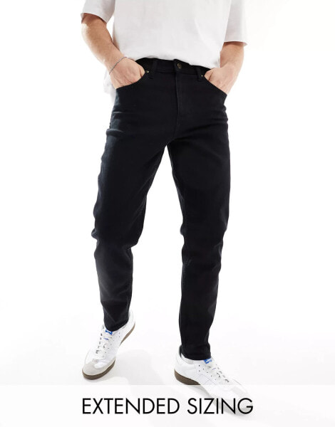 ASOS DESIGN stretch tapered jeans in no fade black