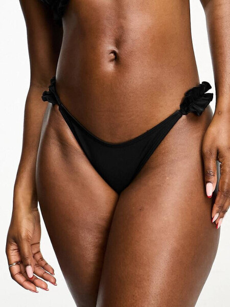 River Island frill tie side bikini bottom in black 