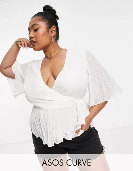 ASOS DESIGN Curve dobby wrap short sleeve blouse with pleated peplum hem in ivory