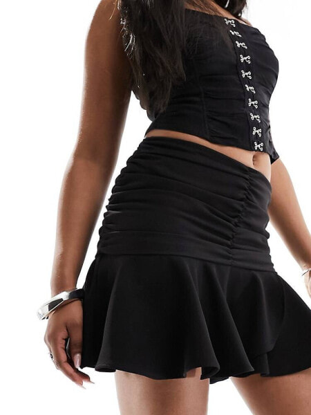 Extro & Vert flippy mini skirt in black