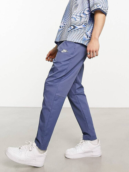 Nike Club woven tapered trousers in blue