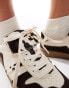 Stradivarius leather trainer in cow print