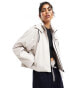 ASOS DESIGN rubberised chuck on rain jacket with pocket detail in stone