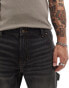 ASOS DESIGN tapered fit jeans with carpenter detail in washed black