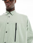 ASOS DESIGN boxy oversized nylon shirt with utility details in green