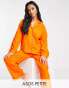 ASOS DESIGN Petite exclusive modal shirt & trouser pyjama set with contrast piping in orange