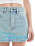 Ed Hardy micro denim mini skirt with blue embroidery and dragon bum