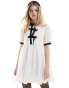 Sister Jane contrast bow lace mini dress in porcelain