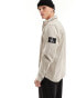 Calvin Klein Jeans monogram logo badge relaxed shirt in taupe