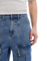 ASOS DESIGN standard length denim jorts with panels in mid blue wash