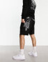 The North Face back graphic lightweight fleece shorts in black